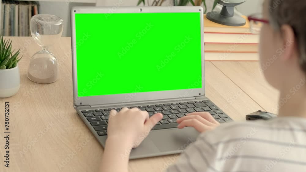 smart child, schoolboy playing with computer, developing brain games, monitor with empty green screen mockup, digital age, cyber education, concept childhood, child development, self-education