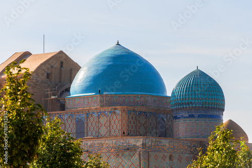 The domes of the medieval mausoleum of Khoja Akhmet Yassawi in the Kazakh city of Turkestan - the heart of the Turkic world photo