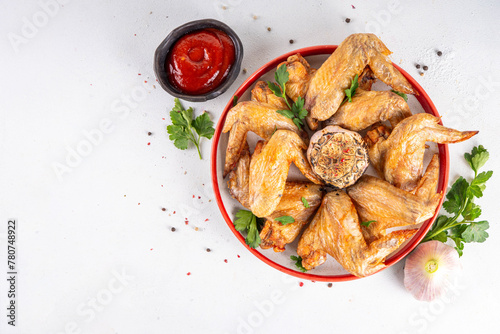 Grilled roasted spicy chicken wings with ketchup
