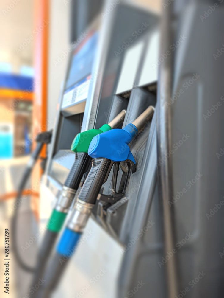Petrol pump filling fuel nozzle in a gas station Petrol pump filling fuel nozzle in a gas station