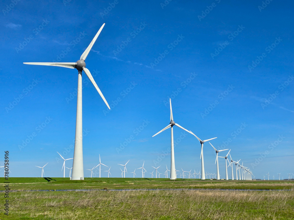 Windmill park in the ocean, drone aerial view of windmill turbines at sea in the Netherlands Windmill park in the ocean, drone aerial view of windmill turbines at sea in the Netherlands