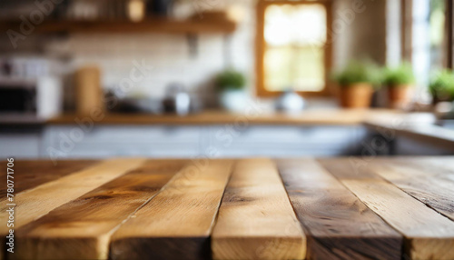 Empty wooden table for product display with blurred kitchen interior on background.