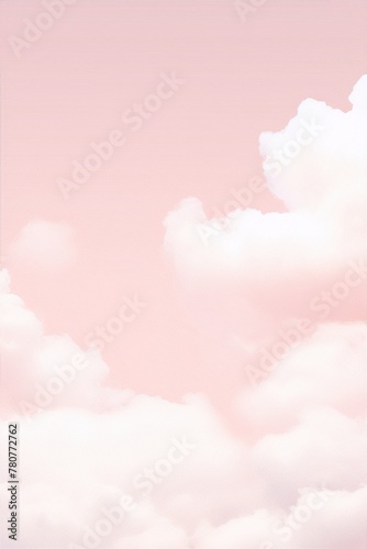 Fluffy white clouds against a pastel pink sky create a dreamy, ethereal scene.