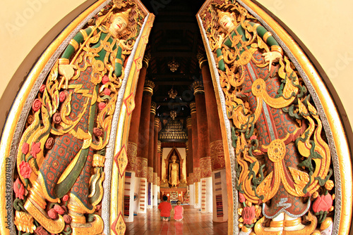Wat bun Yuen (Bun Yuen temple) is Northern-Thai architecture which decorates with Large standing golden Buddha statue at Wiang Sa District, Nan Province, Thailand 