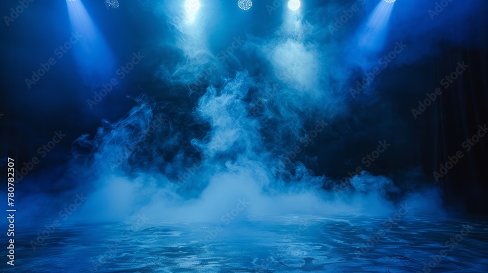 A dramatic blue spotlight illuminates smoke on a stage - obrazy, fototapety, plakaty 