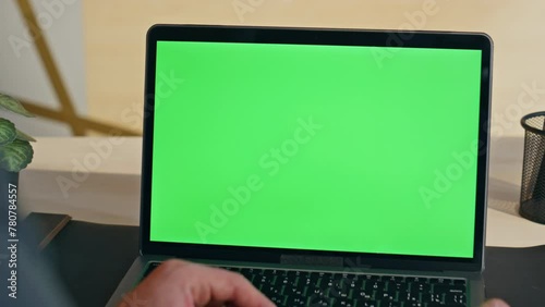 Boss hand swiping touchpad on chromakey laptop starting lesson at home zoom on photo
