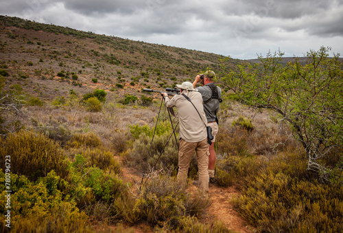 Hunter and professional hunter or PH before shooting trophy animal.