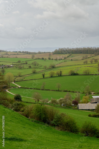 winding lanes and hedgerows over english countryside on cloudy day