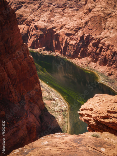 Vertical view looking down on Colorado River in Glen Canyon in red sandstone canyon in Page Arizona