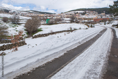 Snow covered access road to a mountain village