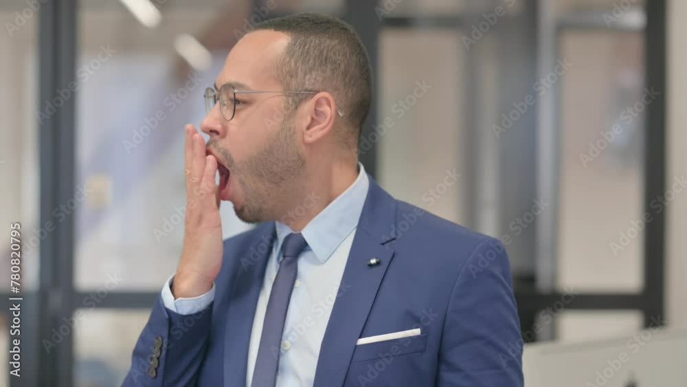 Portrait of Yawning Tired Mixed Race Businessman