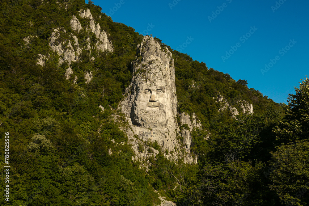 Rock sculpture. Rock sculpture of king Decebal on the bank of Danube River, near the city port of Orsova, Romania.  