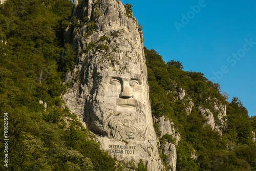 Rock sculpture. Rock sculpture of king Decebal on the bank of Danube River, near the city port of Orsova, Romania.   photo