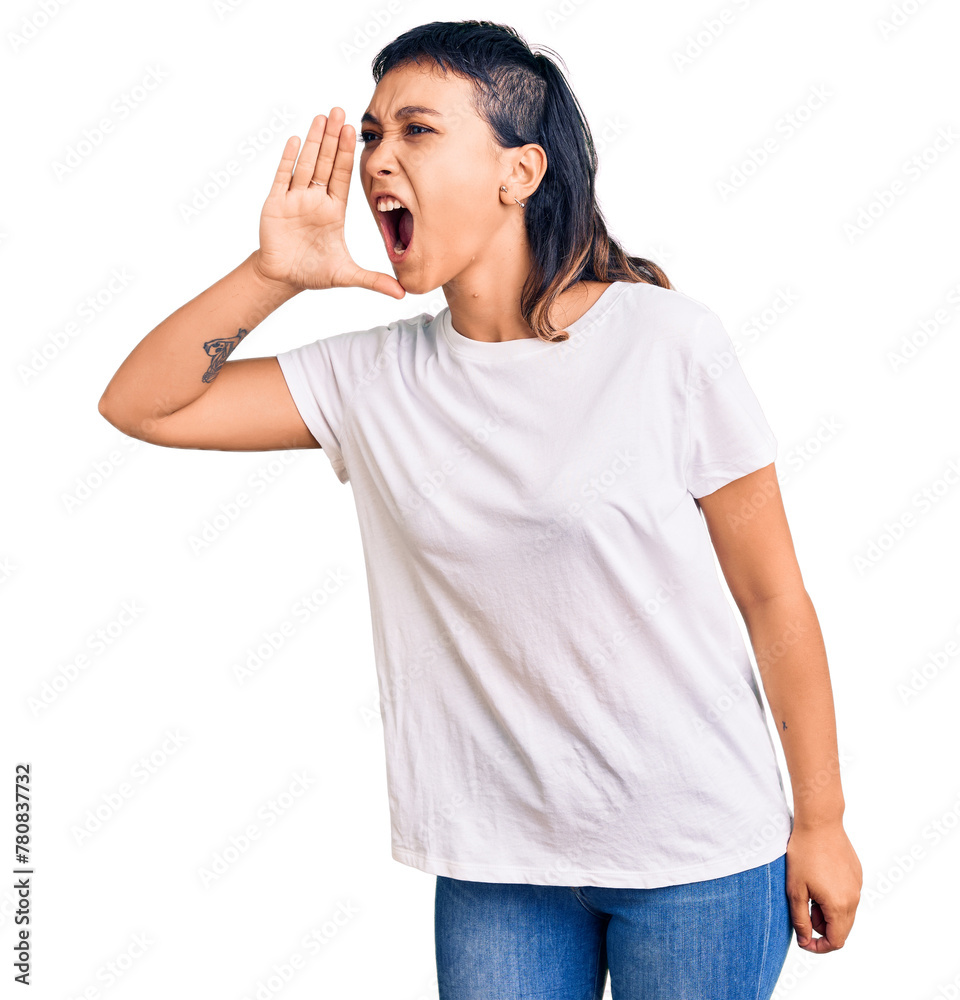 Young woman wearing casual clothes shouting and screaming loud to side with hand on mouth. communication concept. Young woman wearing casual clothes shouting and screaming loud to side with hand on mouth. communication concept.