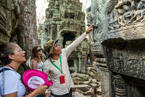 Tour guide explaining history at Angkor Wat photo
