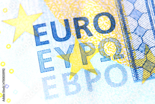 Close-up of a 20 euro banknote fragment with the name of the currency EURO. Macro photography.