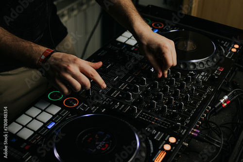 Expert DJ mixing tracks on professional equipment