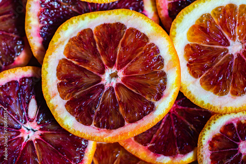 Juicy Sicilian blood orange slices close-up photo