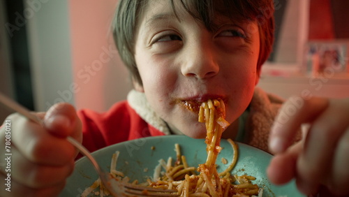 Small Boy Relishing Pasta Plate at Supper, Close-Up of 5-Year-Old Child Savoring Spaghetti Meal, Enjoying Dinner