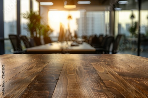 Wooden table with blurred office and meeting room background