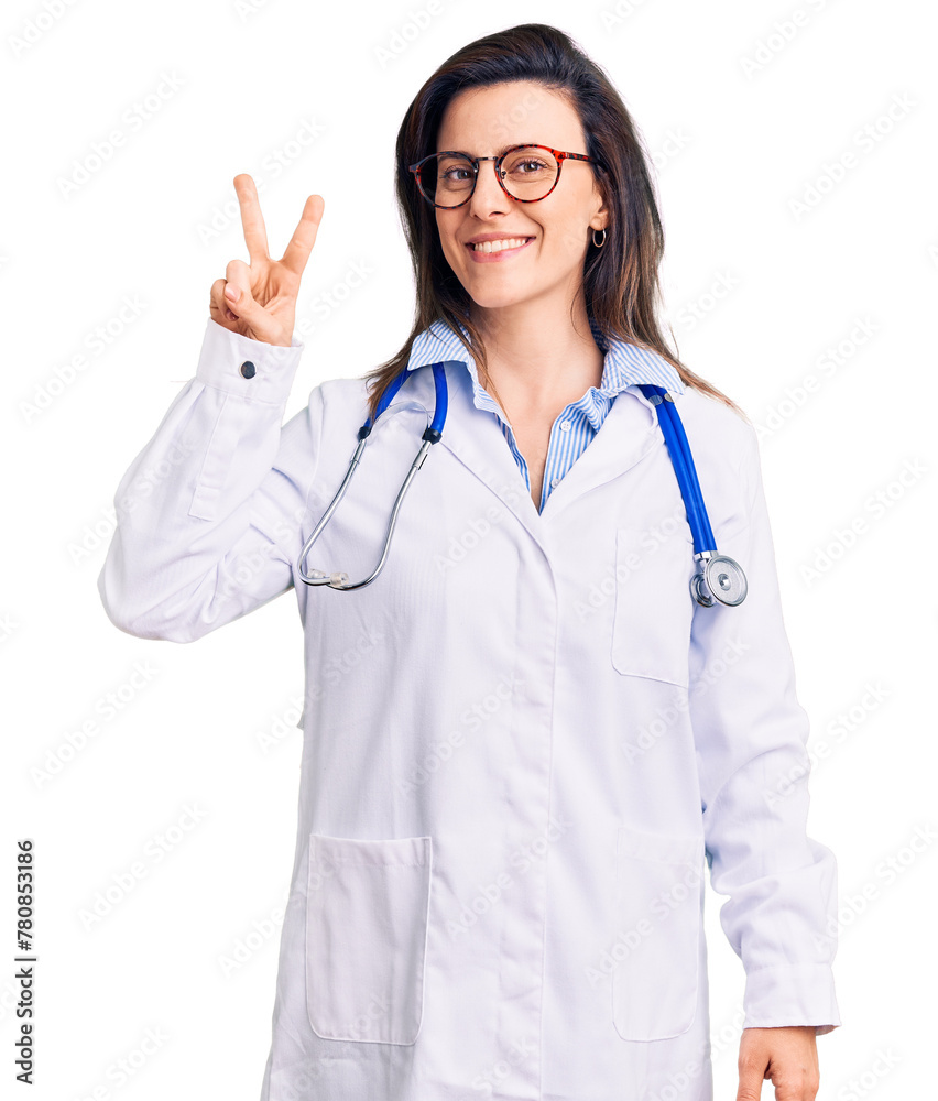 Young beautiful woman wearing doctor stethoscope and glasses showing and pointing up with fingers number two while smiling confident and happy. Young beautiful woman wearing doctor stethoscope and glasses showing and pointing up with fingers number two while smiling confident and happy.