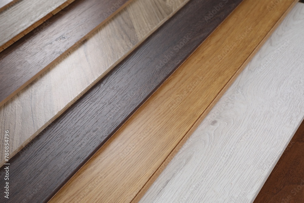 Different samples of wooden flooring as background, flat lay Different samples of wooden flooring as background, flat lay