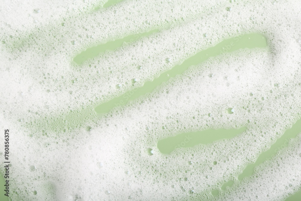 White fluffy foam on green background, top view - obrazy, fototapety, plakaty 