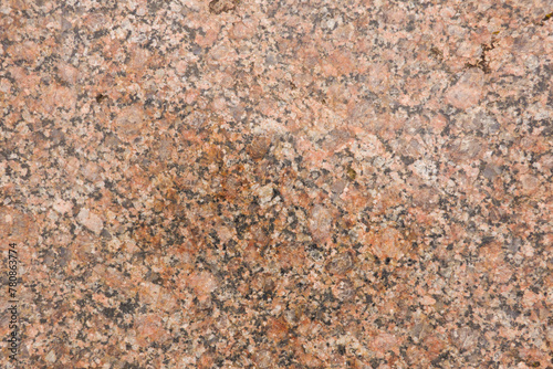 Background of pink and red-brown Filipstad granite containing potassium feldspar and plagioclase crystals