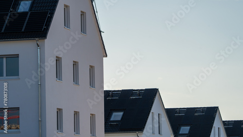 new houses with the solar roof and the blue sky in the evening