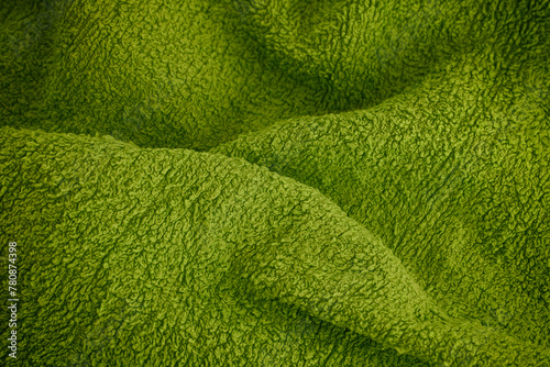 Green towel texture background. Close up.