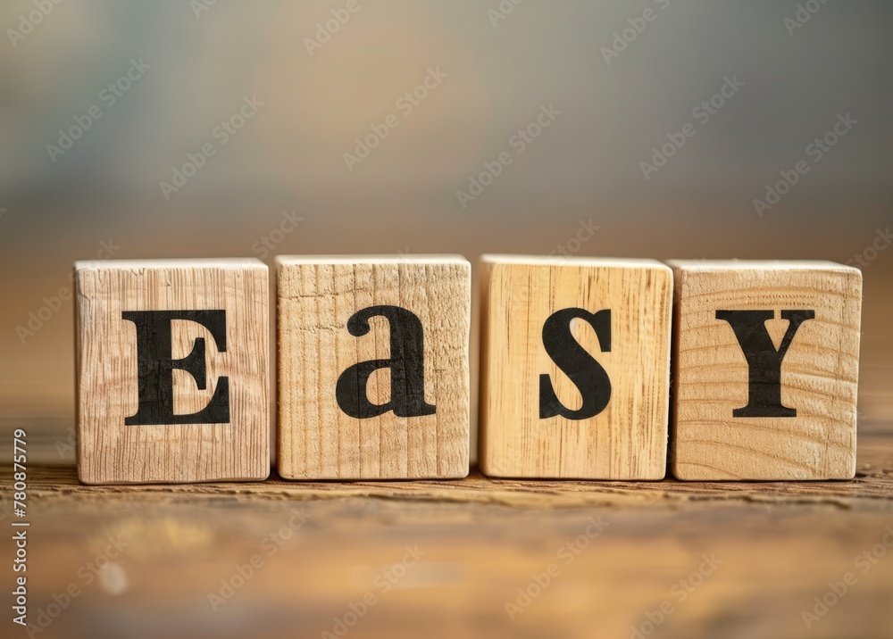 Easy word On wooden blocks, in the style of light beige and black ...