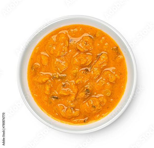 Spicy asian cream soup isolated on white background, top view