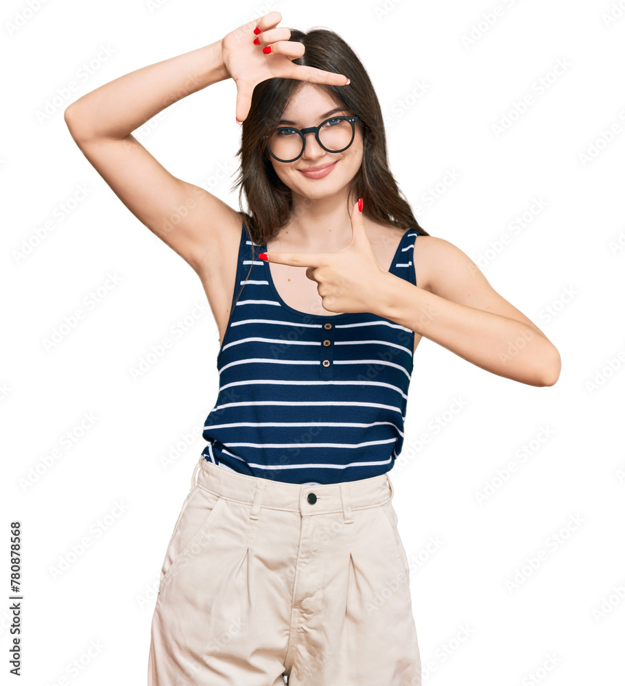 Young beautiful caucasian girl wearing casual clothes and glasses smiling making frame with hands and fingers with happy face. creativity and photography concept. Young beautiful caucasian girl wearing casual clothes and glasses smiling making frame with hands and fingers with happy face. creativity and photography concept.