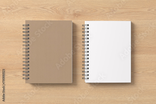Notebook mockup. Closed and open blank notebook with craft paper cover. Spiral notepad on wooden background