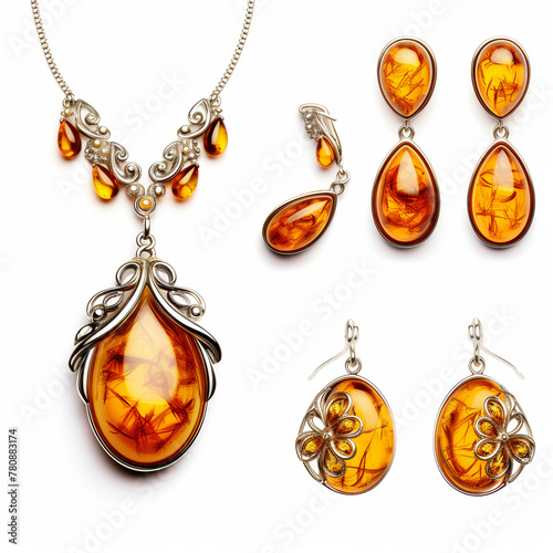 Jewelry earrings and pendant of amber on white background