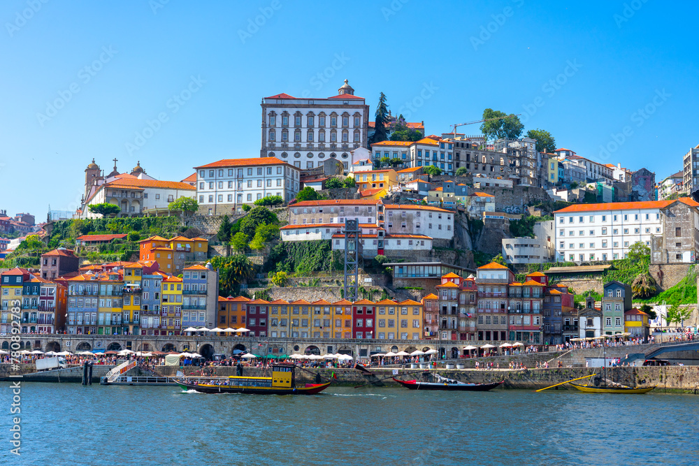 Beautiful colorful building facede in Porto Portugal next to Duero river in Ribeira - obrazy, fototapety, plakaty 