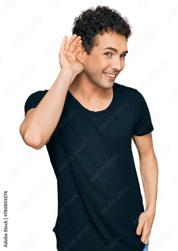 Young handsome man wearing casual black t shirt smiling with hand over ear listening an hearing to rumor or gossip. deafness concept. Young handsome man wearing casual black t shirt smiling with hand over ear listening an hearing to rumor or gossip. deafness concept.