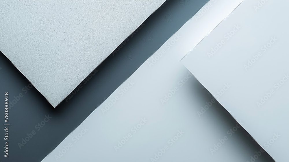 Abstract geometric layers of white and grey paper with shadows.