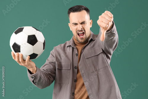 Angry young man with soccer...