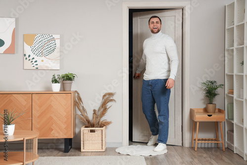 Young man walking through o...