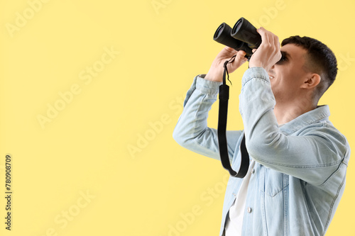 Young man looking through b...