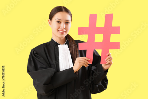 Young female lawyer in robe...