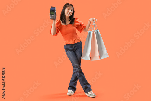 Young Asian woman holding p...