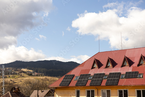 solar panels on the roof of a house in the mountains