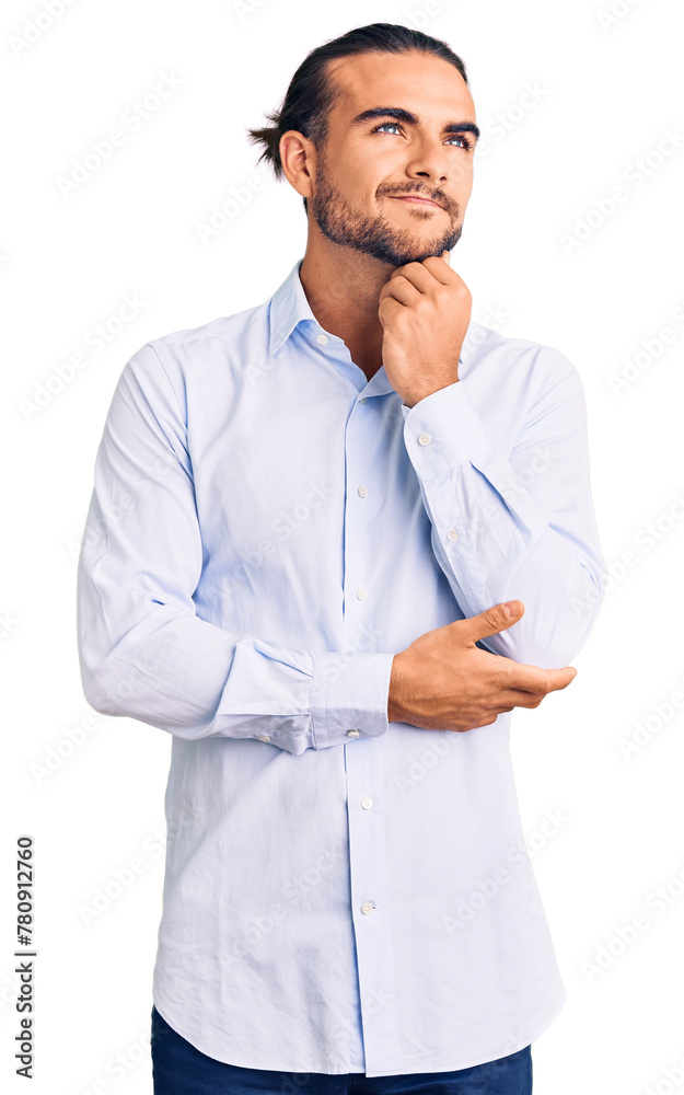 Young handsome man wearing business clothes with hand on chin thinking about question, pensive expression. smiling and thoughtful face. doubt concept. Young handsome man wearing business clothes with hand on chin thinking about question, pensive expression. smiling and thoughtful face. doubt concept.