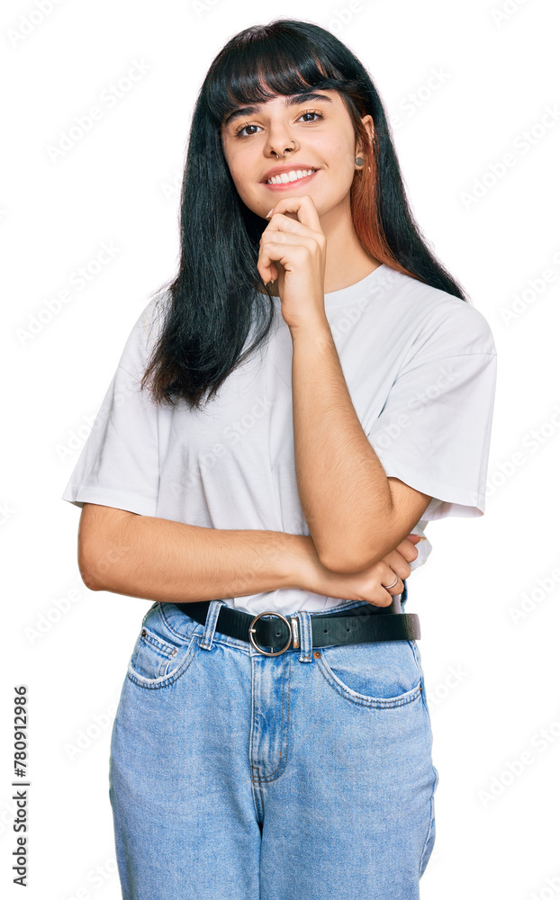 Young hispanic girl wearing casual clothes looking confident at the camera with smile with crossed arms and hand raised on chin. thinking positive. Young hispanic girl wearing casual clothes looking confident at the camera with smile with crossed arms and hand raised on chin. thinking positive.