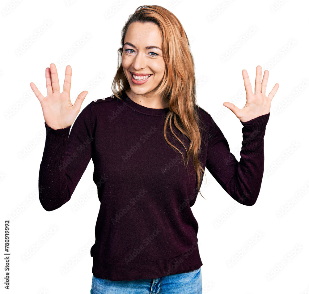 Young caucasian woman wearing casual clothes showing and pointing up with fingers number ten while smiling confident and happy. Young caucasian woman wearing casual clothes showing and pointing up with fingers number ten while smiling confident and happy.