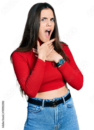Young brunette teenager wearing red turtleneck sweater shouting suffocate because painful strangle. health problem. asphyxiate and suicide concept.