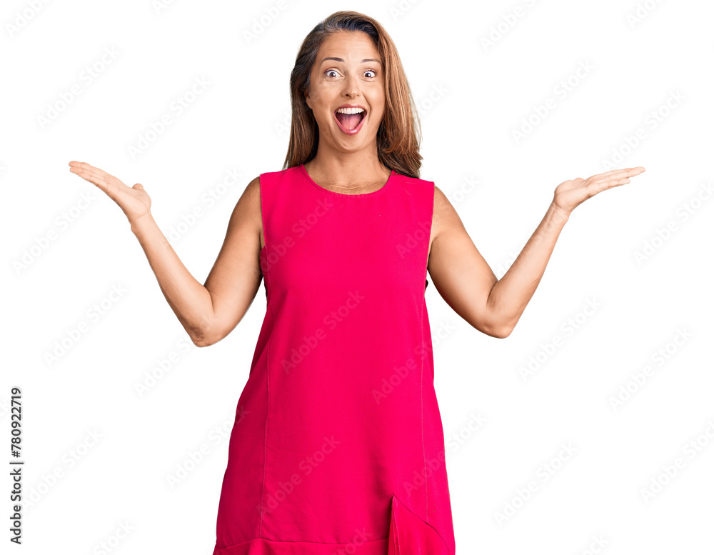 Middle age hispanic woman wearing casual clothes celebrating victory with happy smile and winner expression with raised hands Middle age hispanic woman wearing casual clothes celebrating victory with happy smile and winner expression with raised hands
