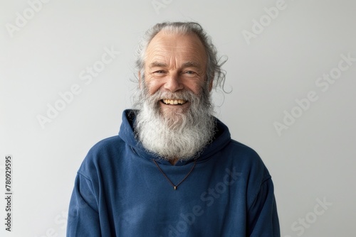 A man with a long beard wearing a blue hoodie. Suitable for various projects photo